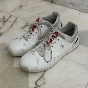 On Running White and Red Sneakers